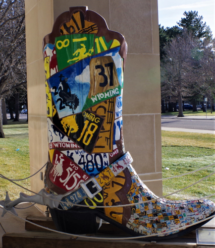 boot covered with colorful WY license plates
